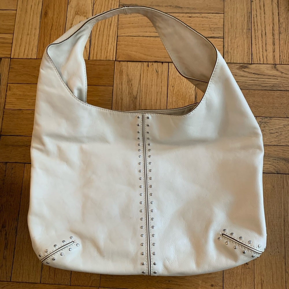 Off white leather and studded michael kors handbag.